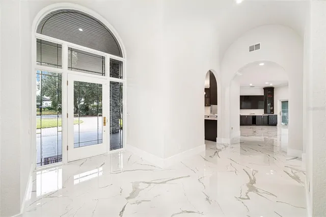 a view of a living room with a sink and refrigerator