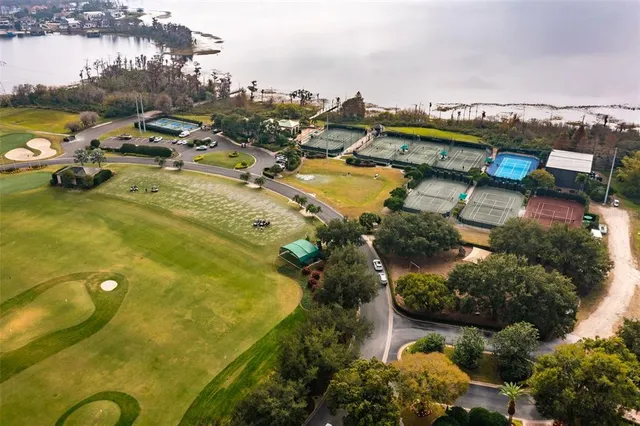 an aerial view of a residential houses with outdoor space