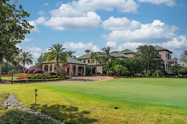 a front view of house with yard and trees