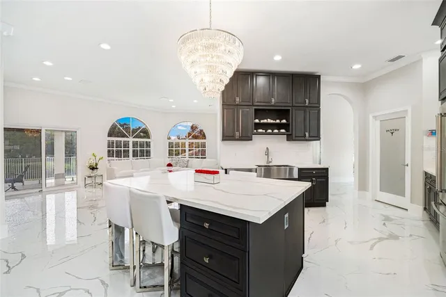 a kitchen with a sink cabinets and window