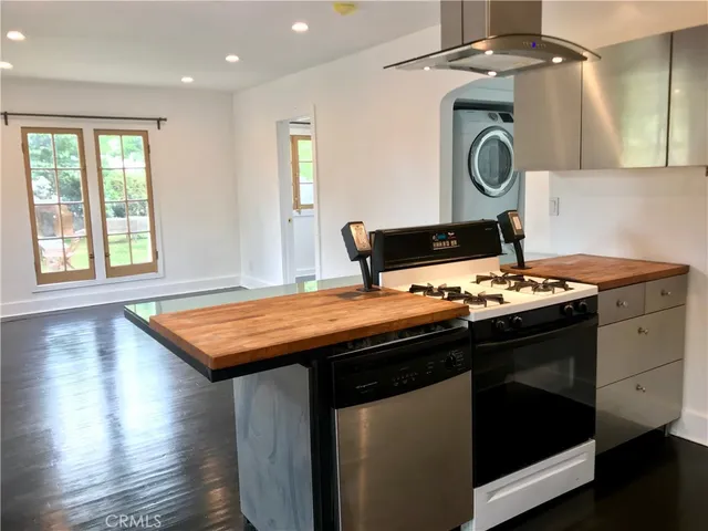 a kitchen with a stove and a microwave