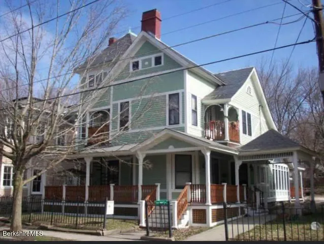 a front view of a houses on the street