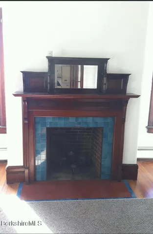 a view of living room and a fireplace