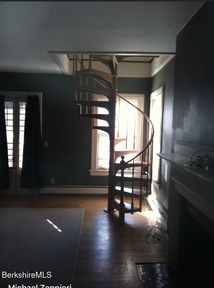 144 Church Street, Unit 2 North Adams, MA 01247 - Photo 8 of 8 a view of entryway and hall with wooden floor