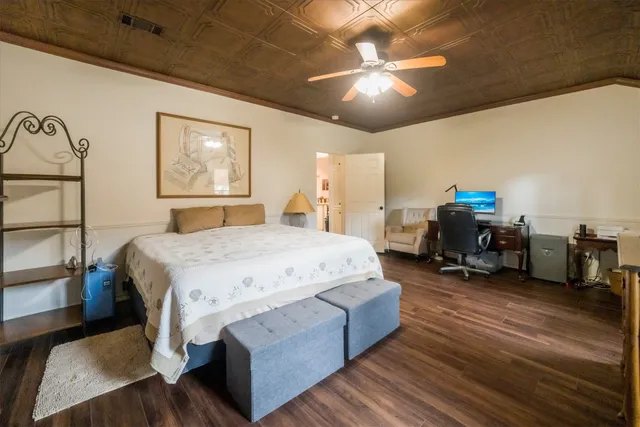 a spacious bathroom with a granite countertop sink mirror and shower