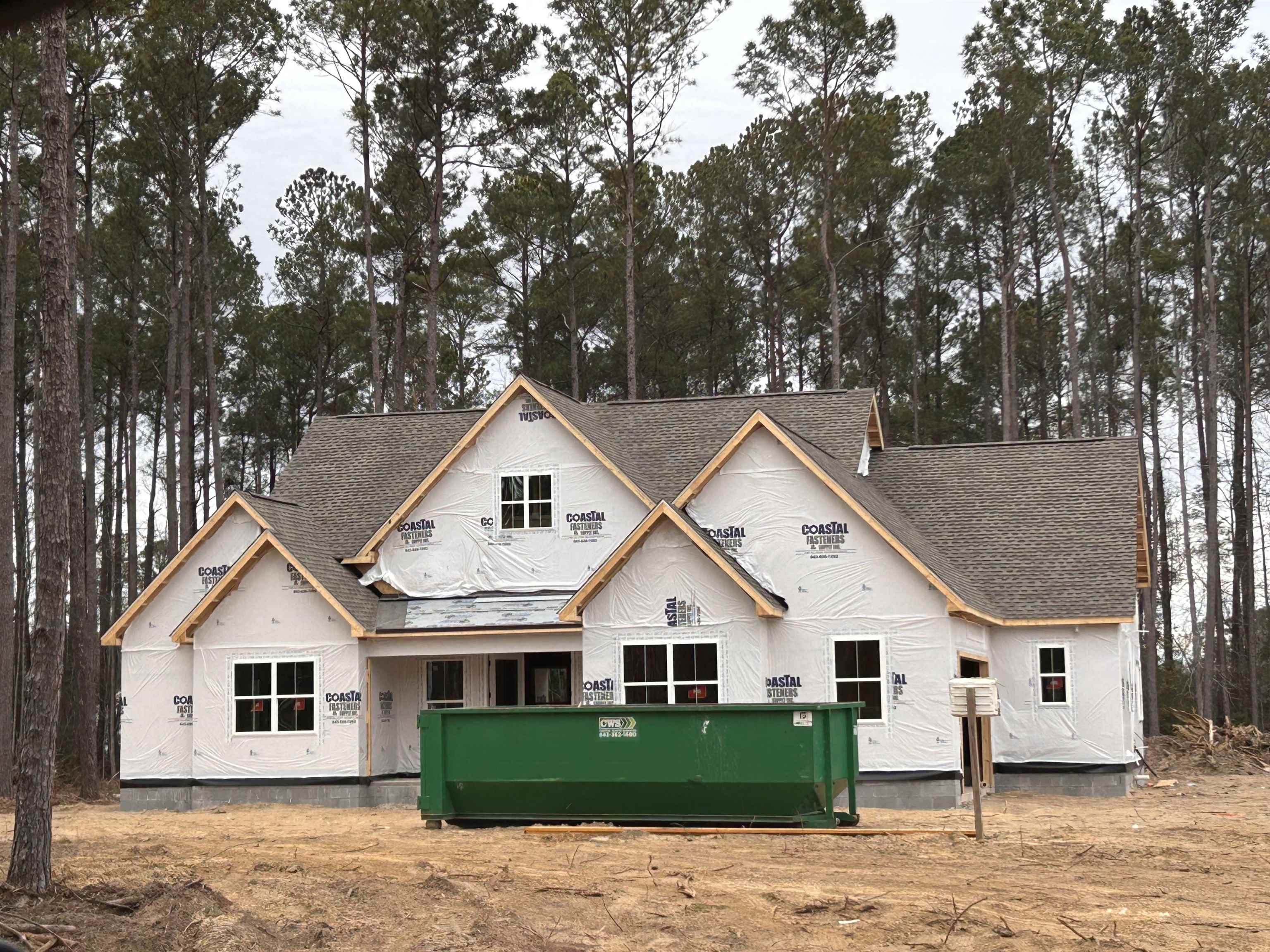 1449 Hucks Road Aynor, SC 29511 - Photo 1 of 1 Rear view of house with roof with shingles and view of scattered trees