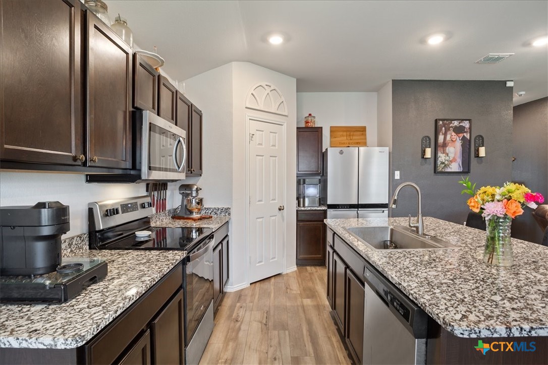 1000 Velvet Court Troy, TX 76579 - Photo 12 of 25 a kitchen with granite countertop lots of counter top space