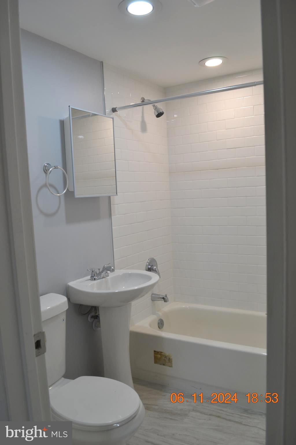 329 A Bar Harbor Road Pasadena, MD 21122 - Photo 11 of 18 a bathroom with a sink a toilet and shower