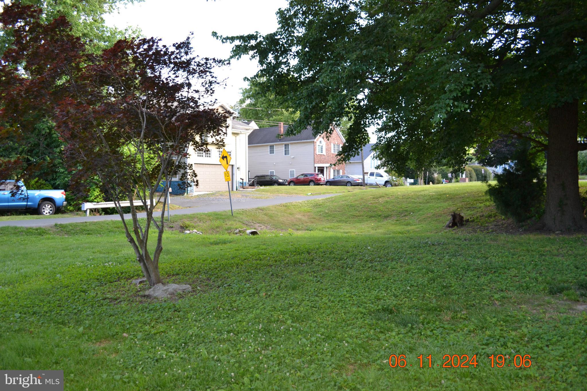 329 A Bar Harbor Road Pasadena, MD 21122 - Photo 3 of 18 a view of a park with large trees