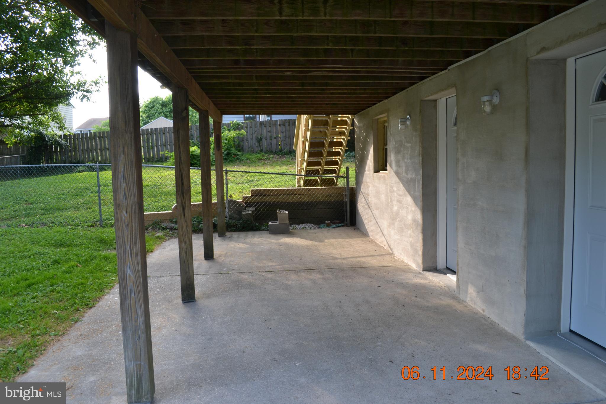 329 A Bar Harbor Road Pasadena, MD 21122 - Photo 6 of 18 a view of a porch with a table and chairs