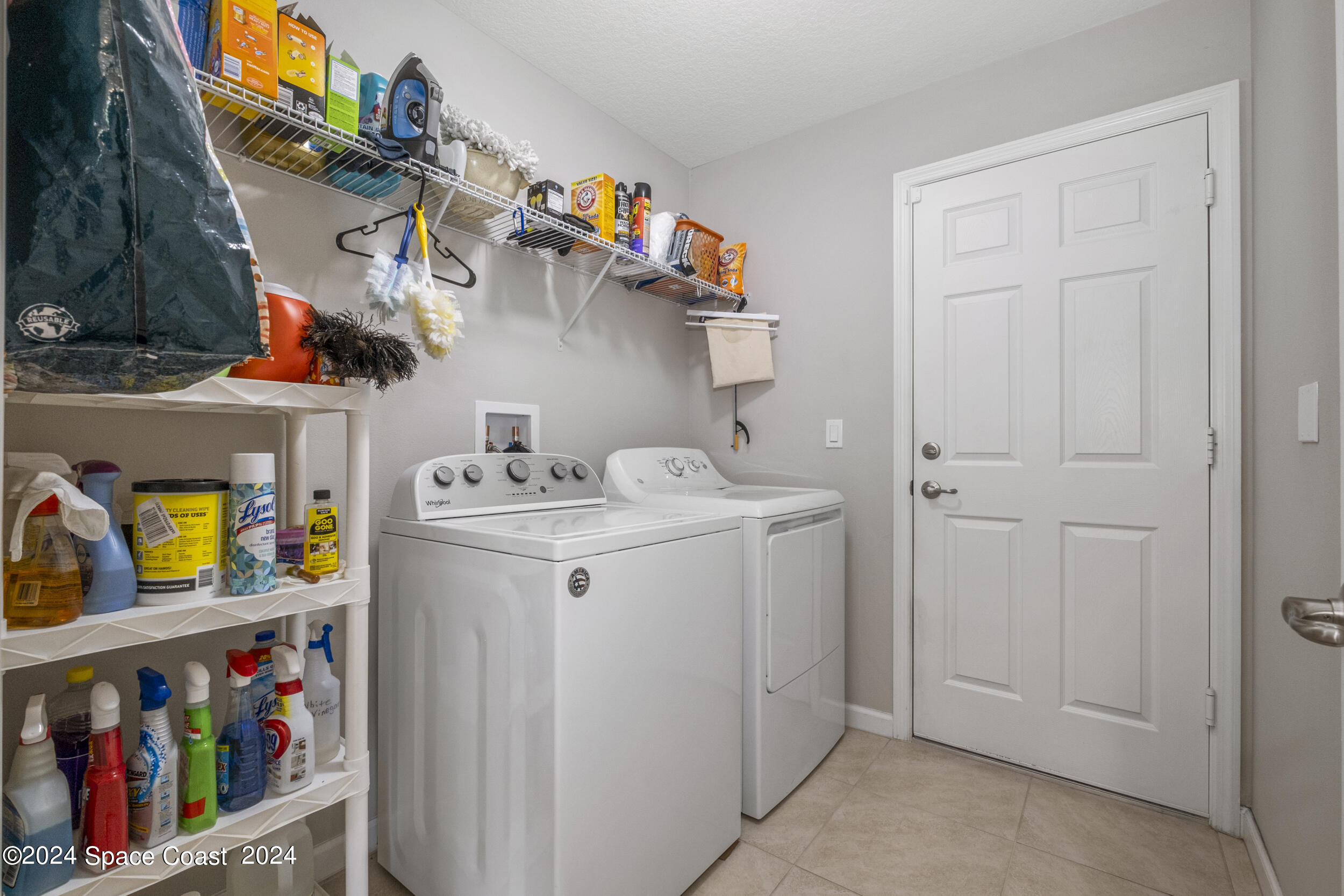 1011 Grapefruit Road Southeast Palm Bay, FL 32909 - Photo 30 of 42 a utility room with dryer and washer