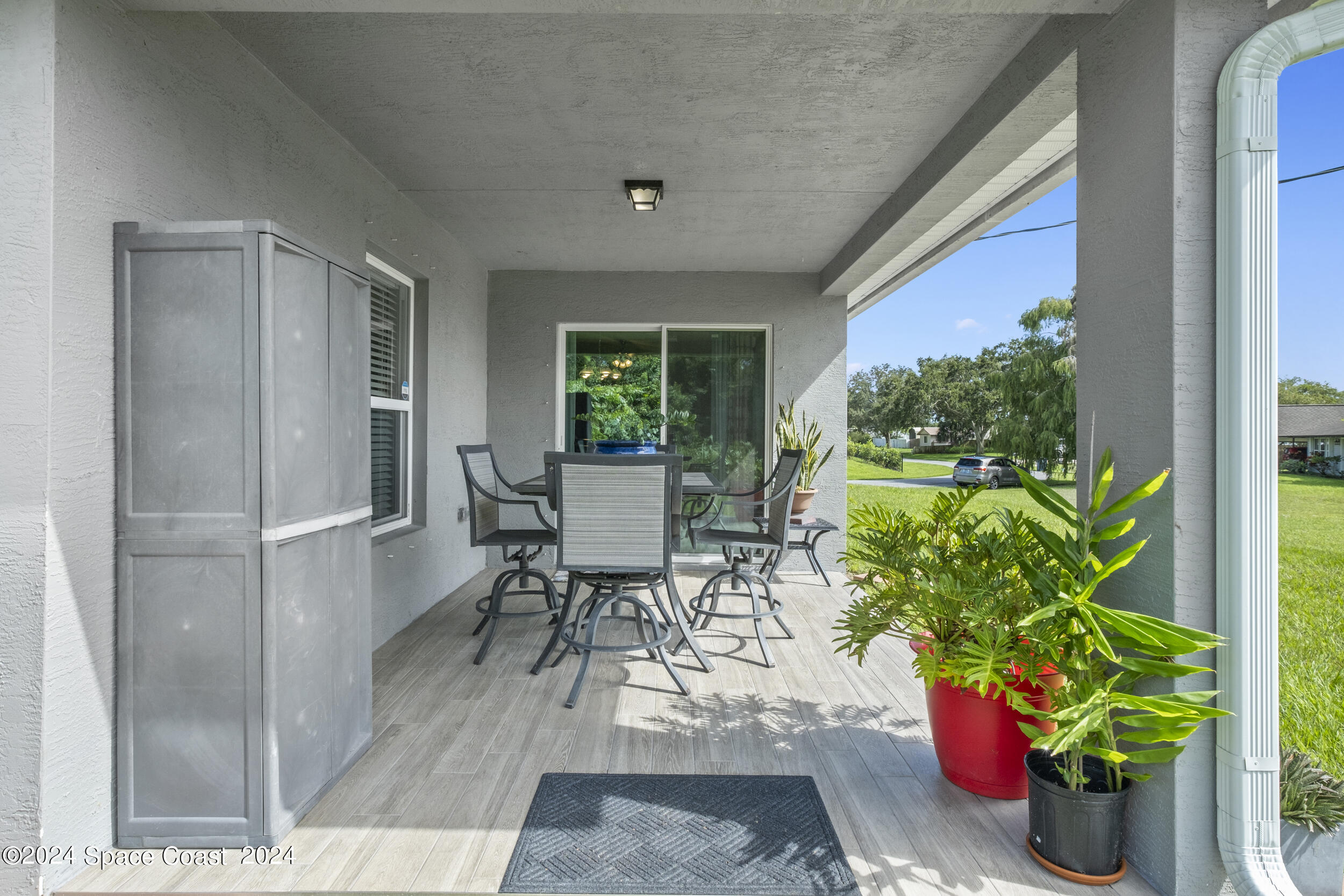 1011 Grapefruit Road Southeast Palm Bay, FL 32909 - Photo 31 of 42 a workspace with furniture and a potted plant