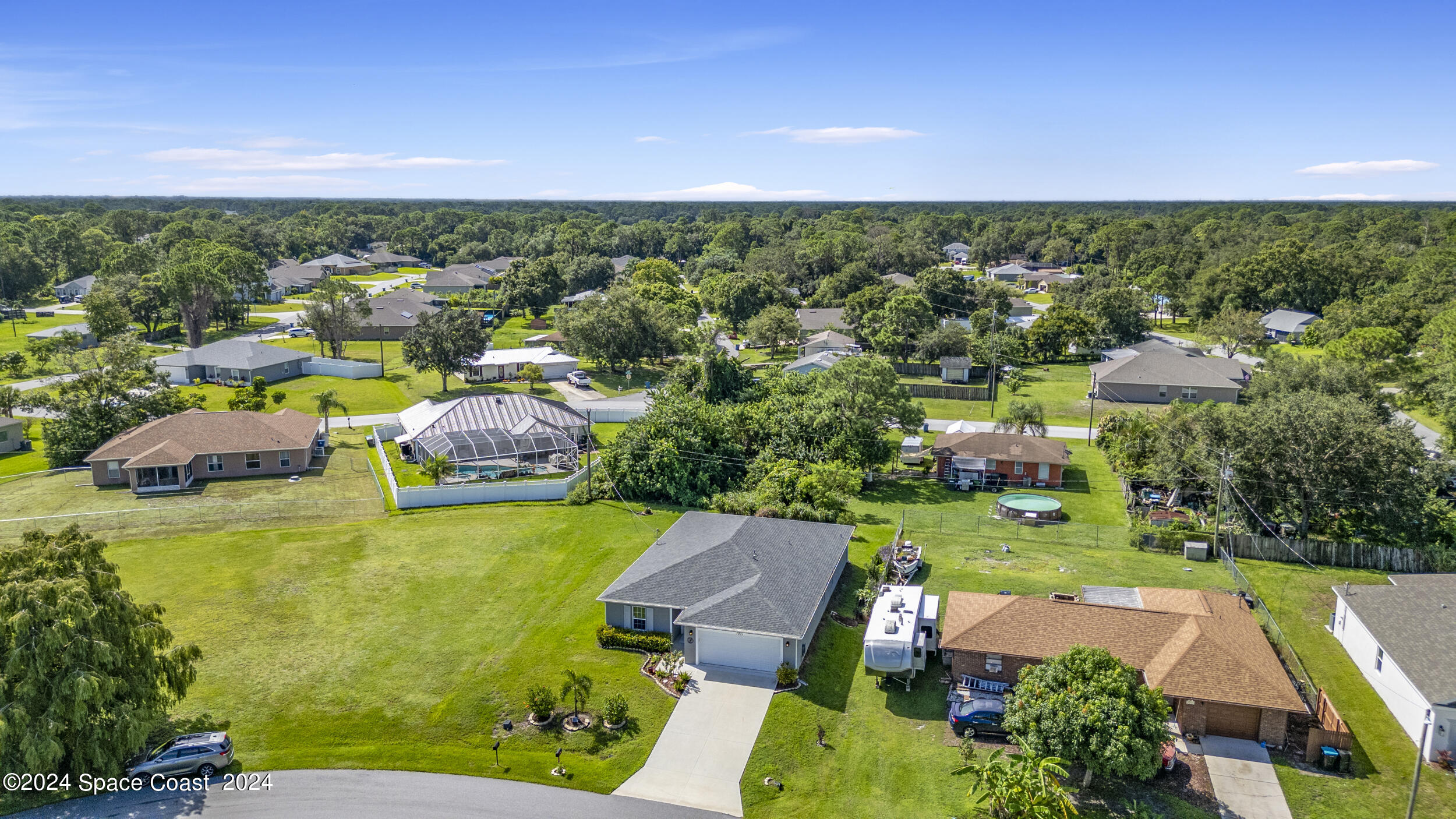1011 Grapefruit Road Southeast Palm Bay, FL 32909 - Photo 39 of 42 a view of a city with lawn chairs