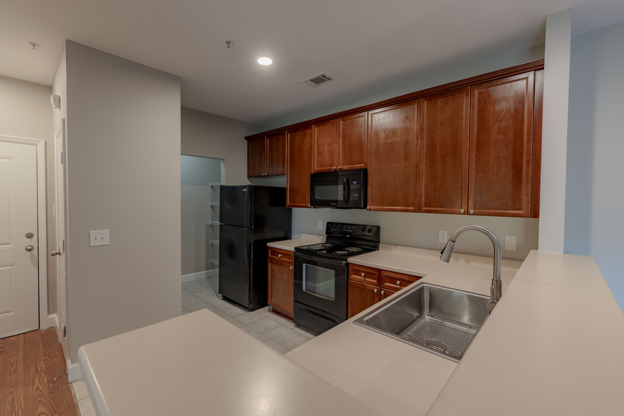 7321 Althorp Way, Unit R5 Nashville, TN 37211 - Photo 3 of 29 a kitchen with a refrigerator stove top oven a sink and dishwasher