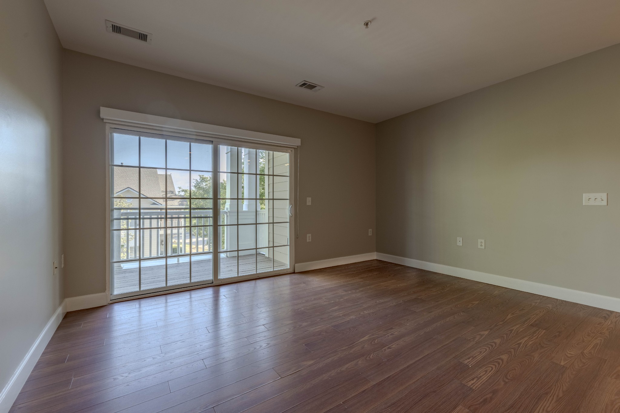 7321 Althorp Way, Unit R5 Nashville, TN 37211 - Photo 6 of 29 a view of an empty room with wooden floor and a window