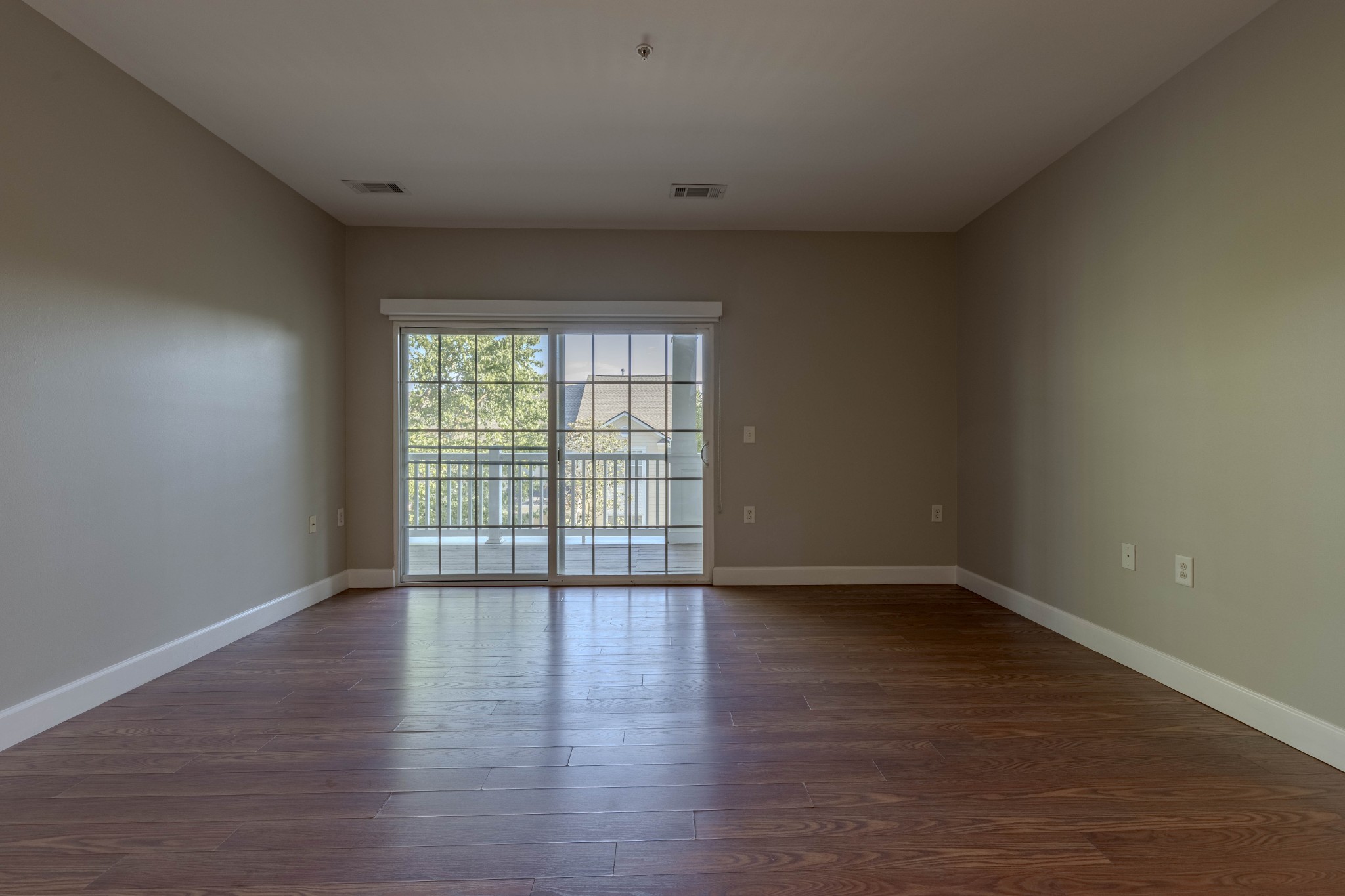 7321 Althorp Way, Unit R5 Nashville, TN 37211 - Photo 7 of 29 a view of an empty room with wooden floor and a window