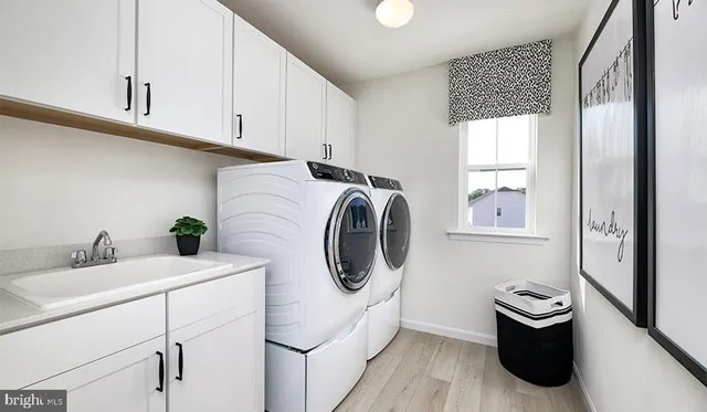 a bathroom with a granite countertop toilet and a sink