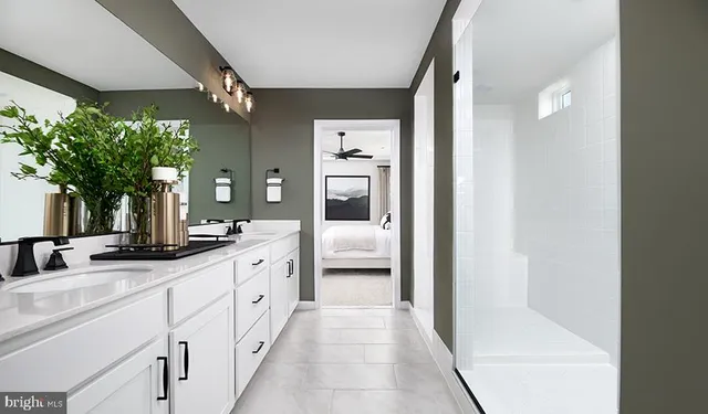 a bathroom with a double vanity sink and mirror