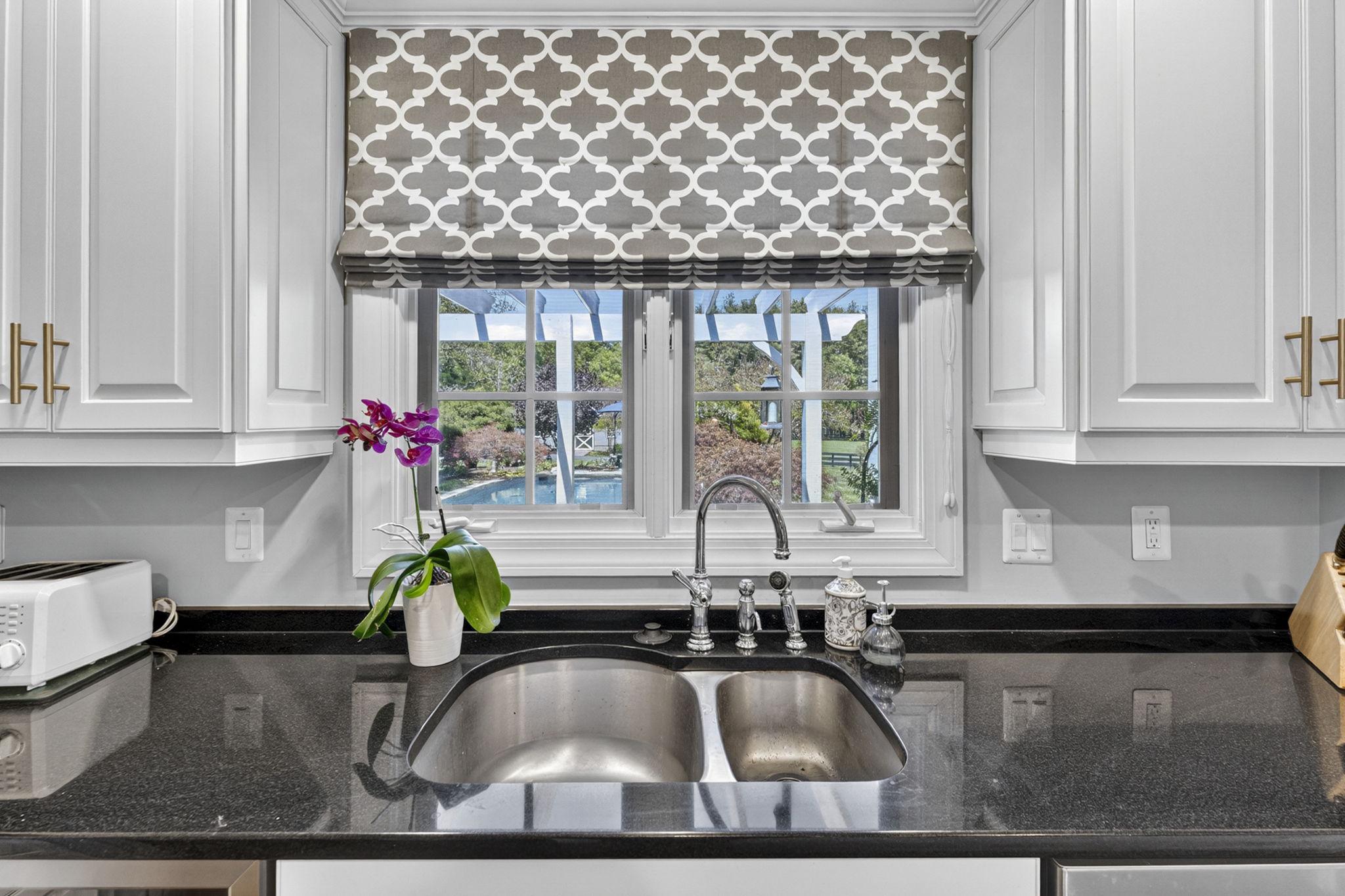 23559 Parsons Road Middleburg, VA 20117 - Photo 20 of 75 a kitchen with a sink granite counter tops and a window