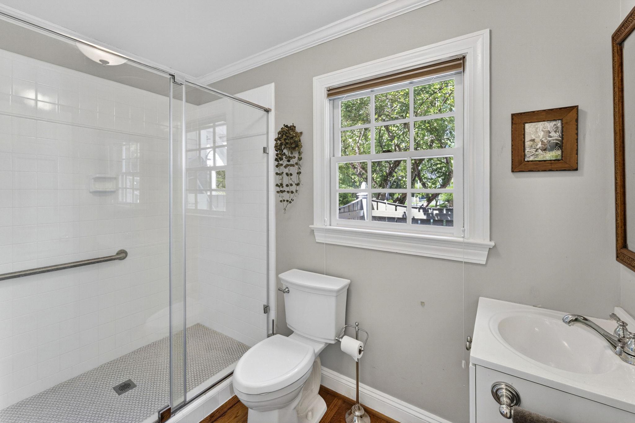 23559 Parsons Road Middleburg, VA 20117 - Photo 32 of 75 a white toilet sitting next to a bathroom sink