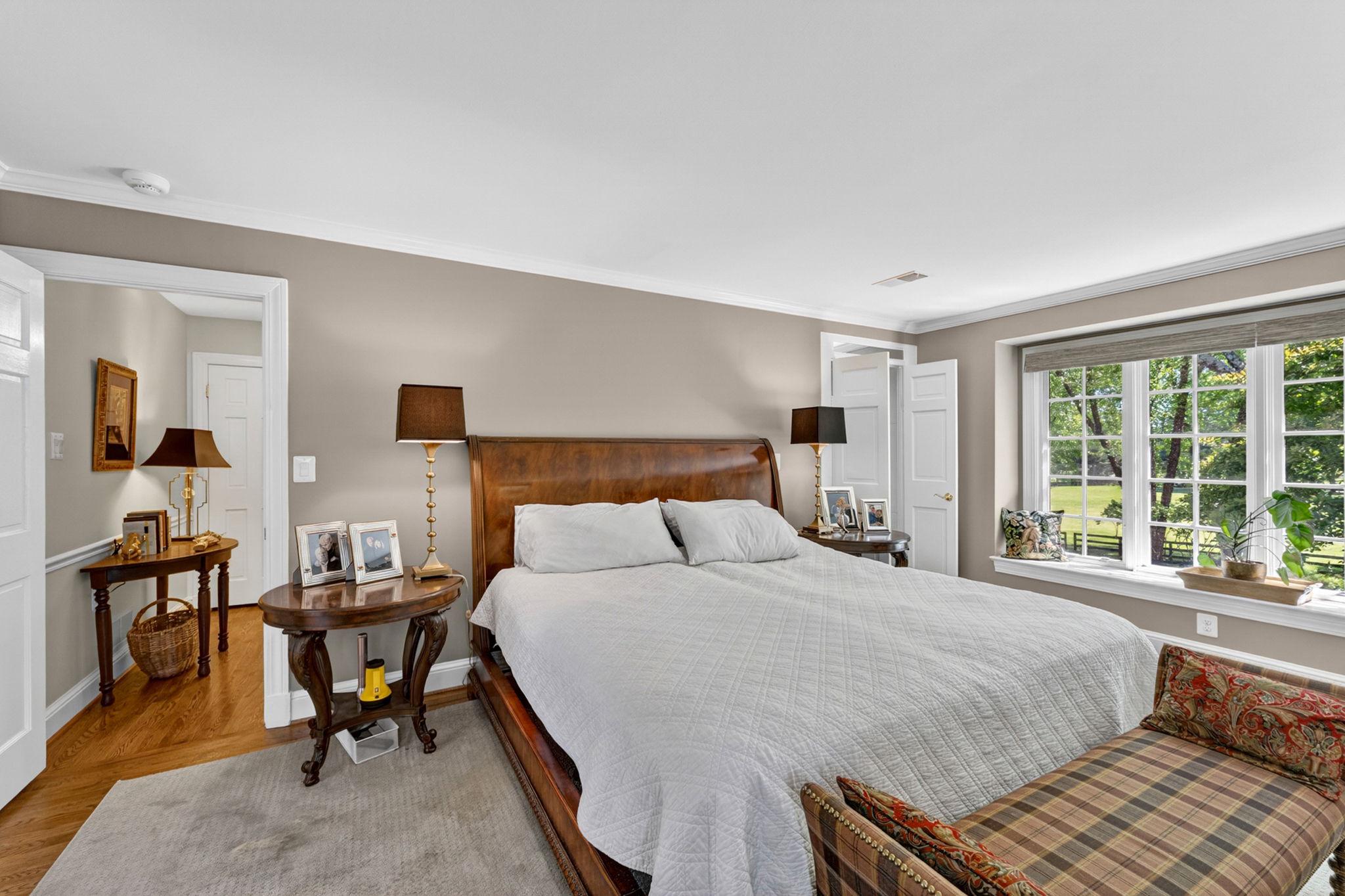 23559 Parsons Road Middleburg, VA 20117 - Photo 35 of 75 a bedroom with a bed and wooden floor