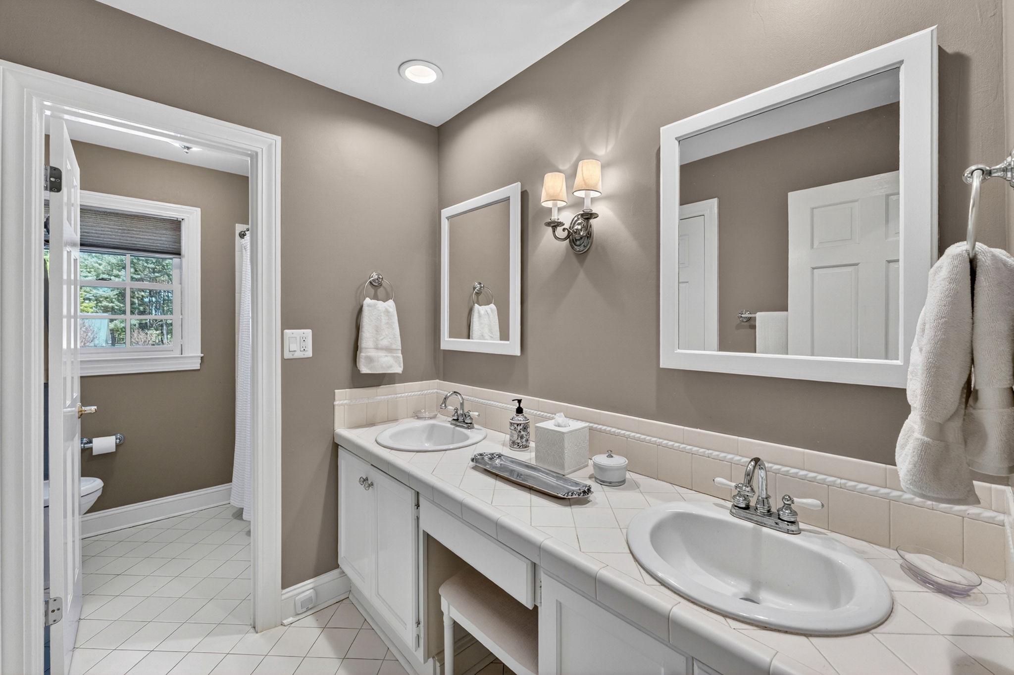 23559 Parsons Road Middleburg, VA 20117 - Photo 41 of 75 a bathroom with a sink and a mirror