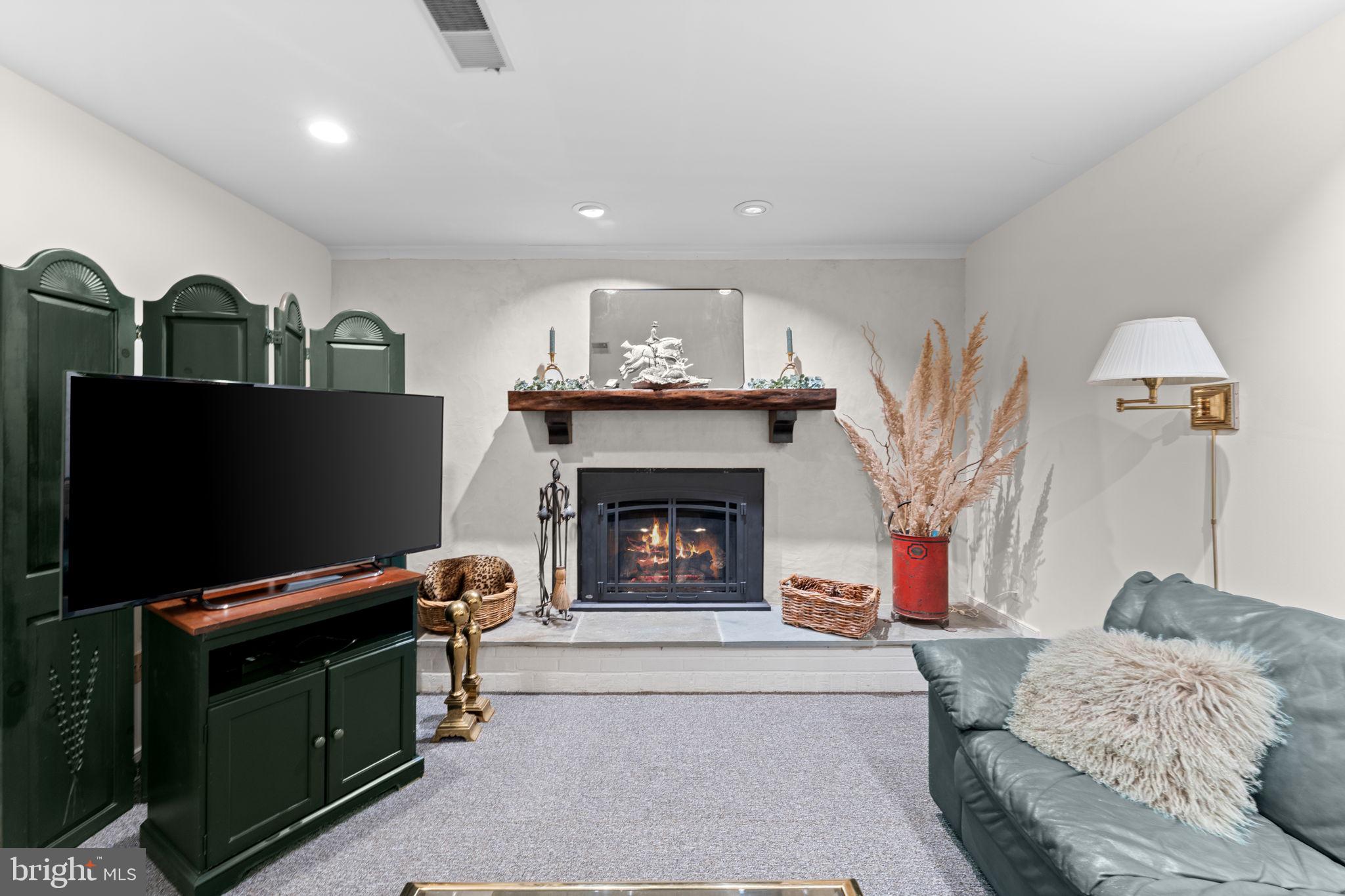 23559 Parsons Road Middleburg, VA 20117 - Photo 46 of 75 a living room with furniture and a fireplace