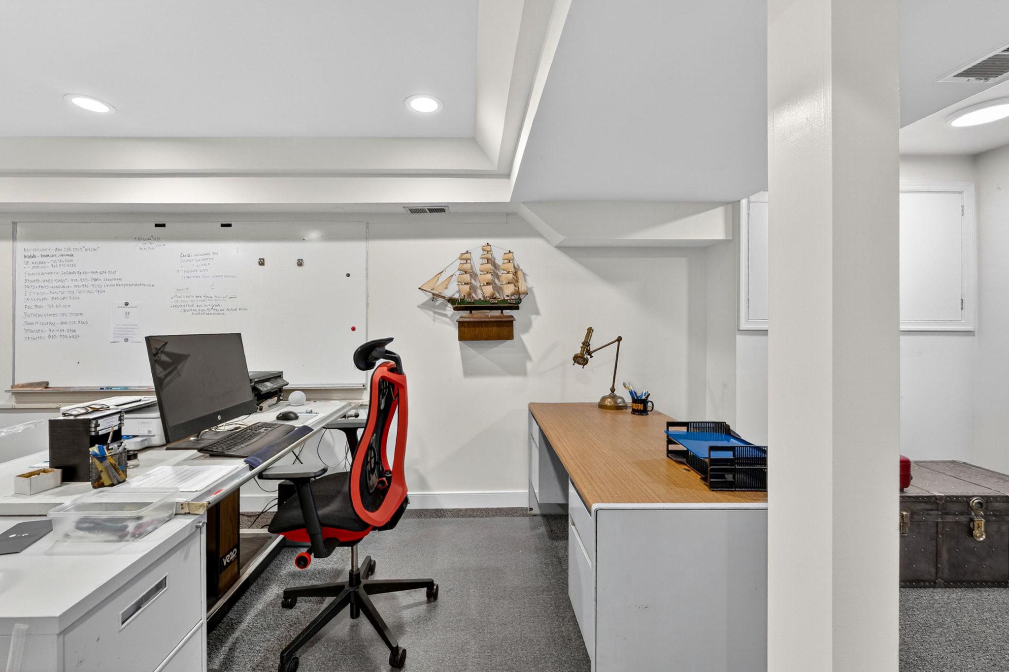 23559 Parsons Road Middleburg, VA 20117 - Photo 48 of 75 a view of a workspace with furniture and a gate