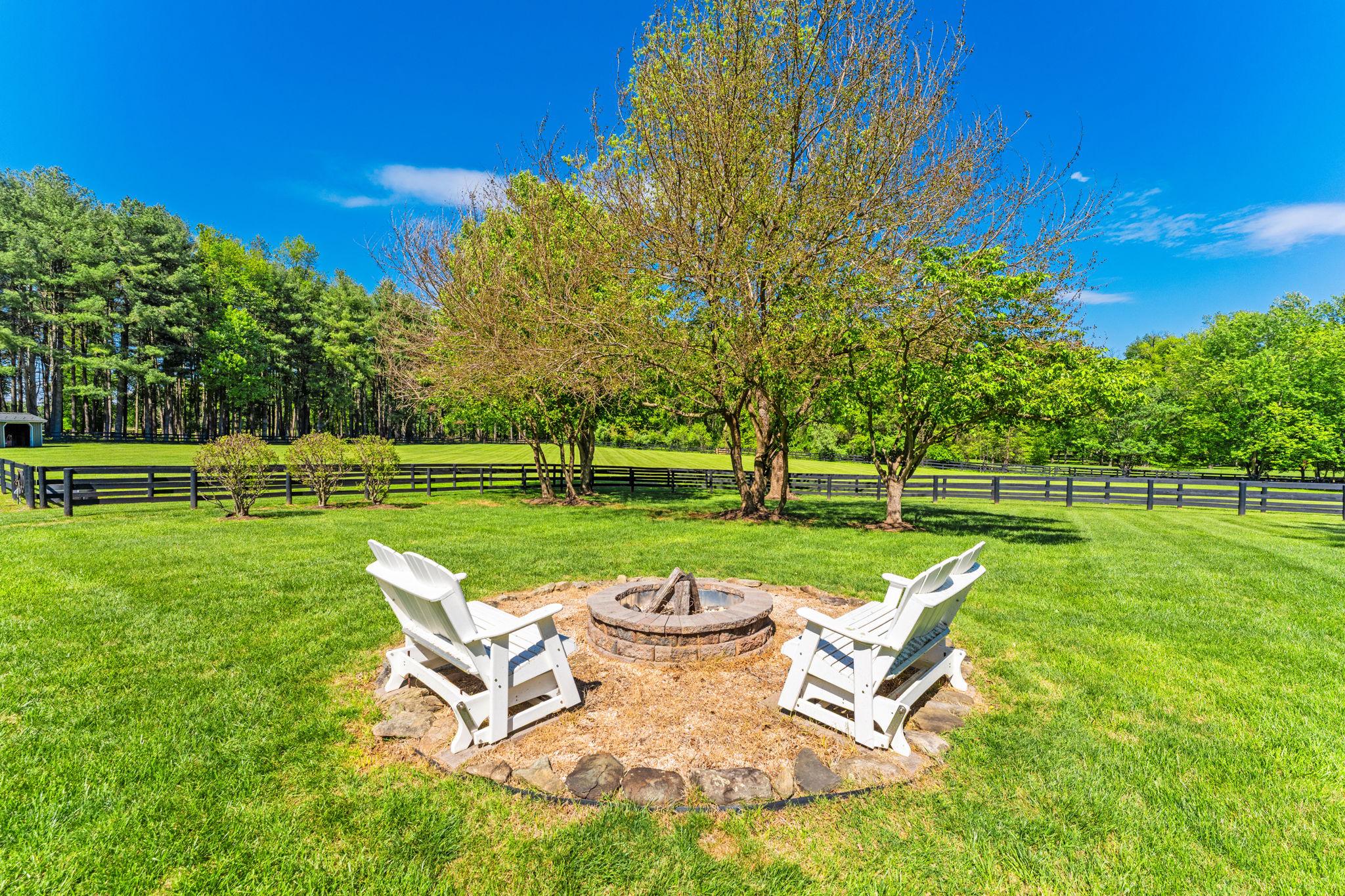 23559 Parsons Road Middleburg, VA 20117 - Photo 59 of 75 a view of a table and chairs in backyard of the house
