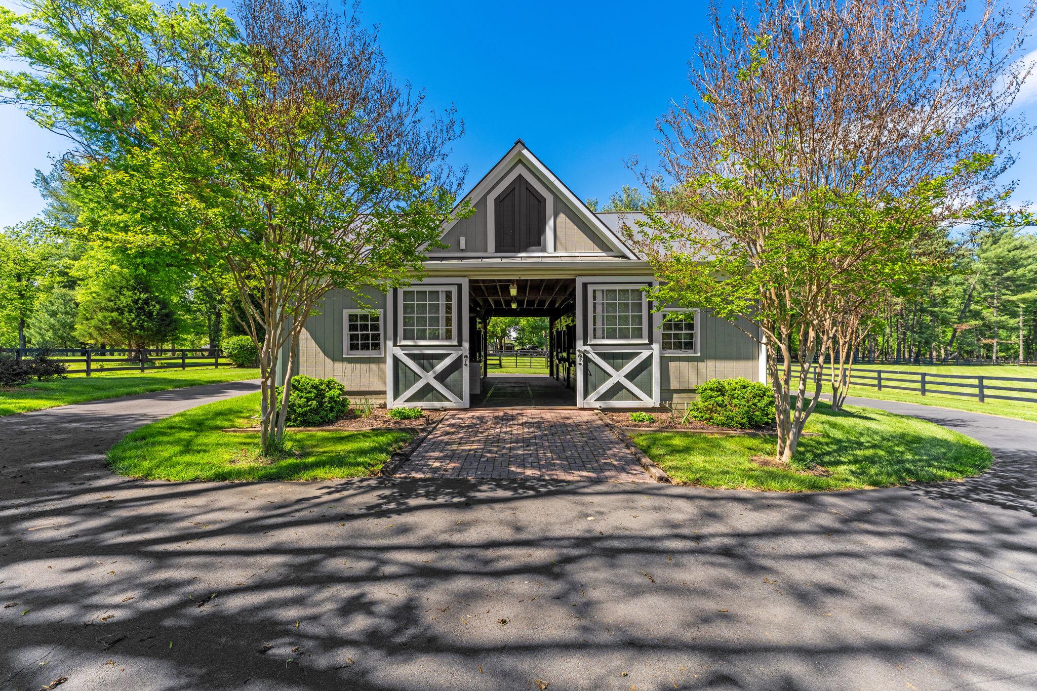 23559 Parsons Road Middleburg, VA 20117 - Photo 63 of 75 a front view of a house with garden