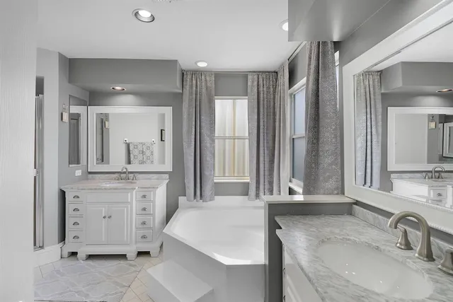 a view of a patio with a dining table and chairs