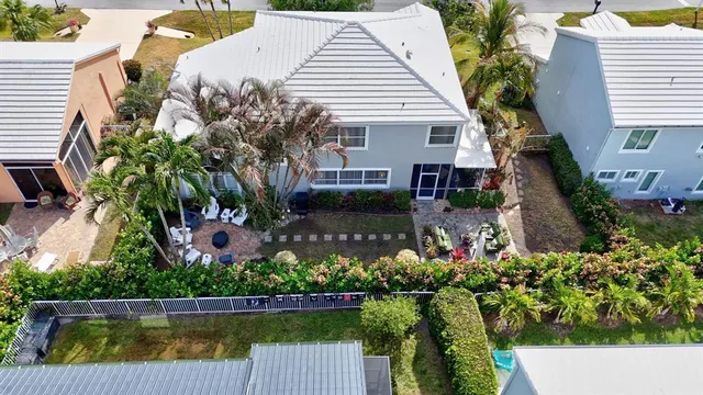 an aerial view of residential house with pool and ocean view