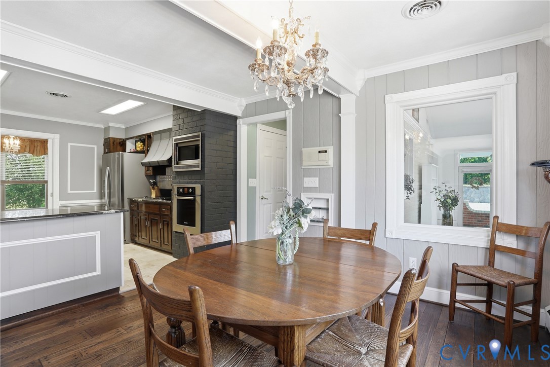 13300 West Patrick Henry Road Doswell, VA 23047 - Photo 14 of 69 Dining area featuring wood-finish flooring, a chan