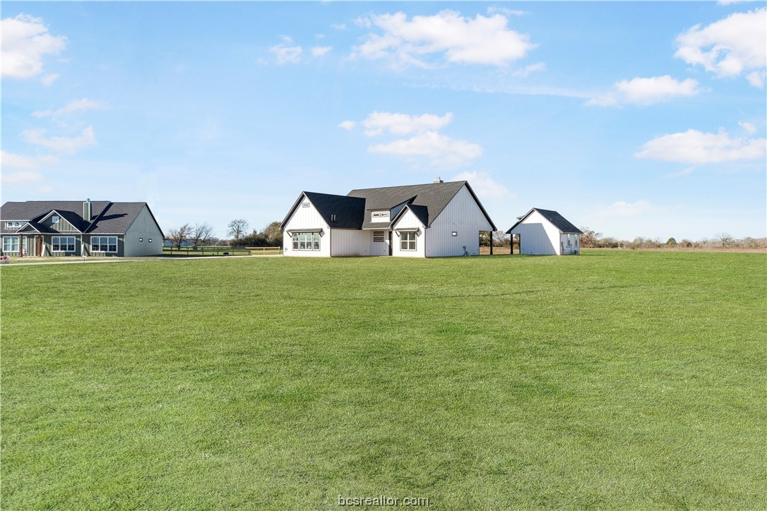 a view of a swimming pool with an outdoor seating
