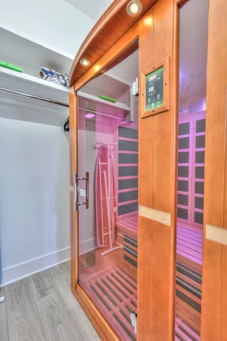 a view of front door and wooden floor