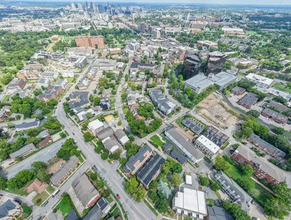 an aerial view of residential houses with outdoor space