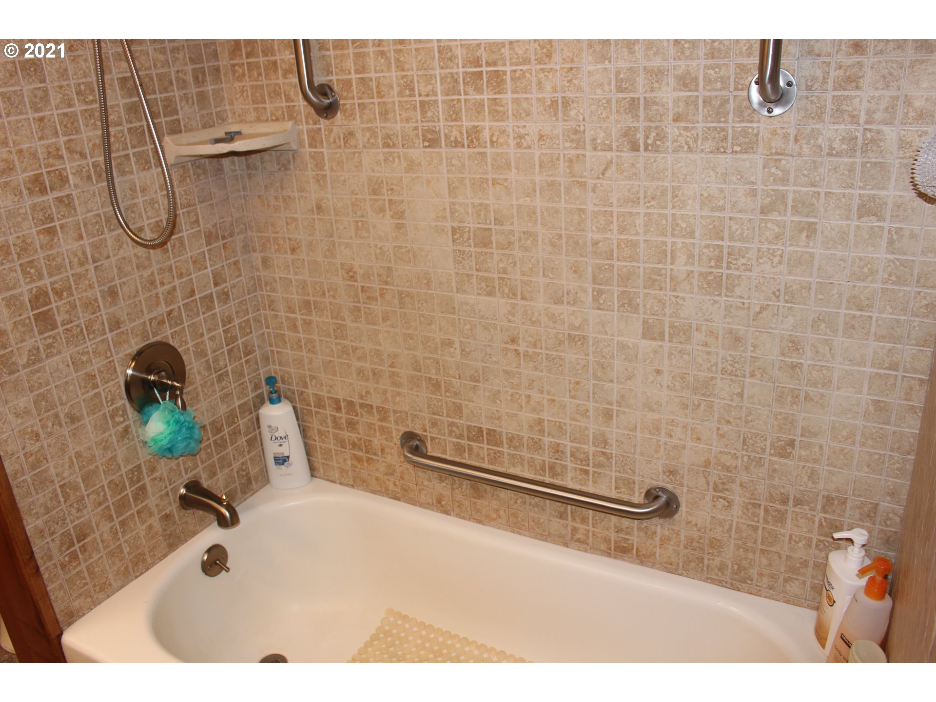 66069 North Bay Road North Bend, OR 97459 - Photo 22 of 32 a bathroom with a sink and a shower