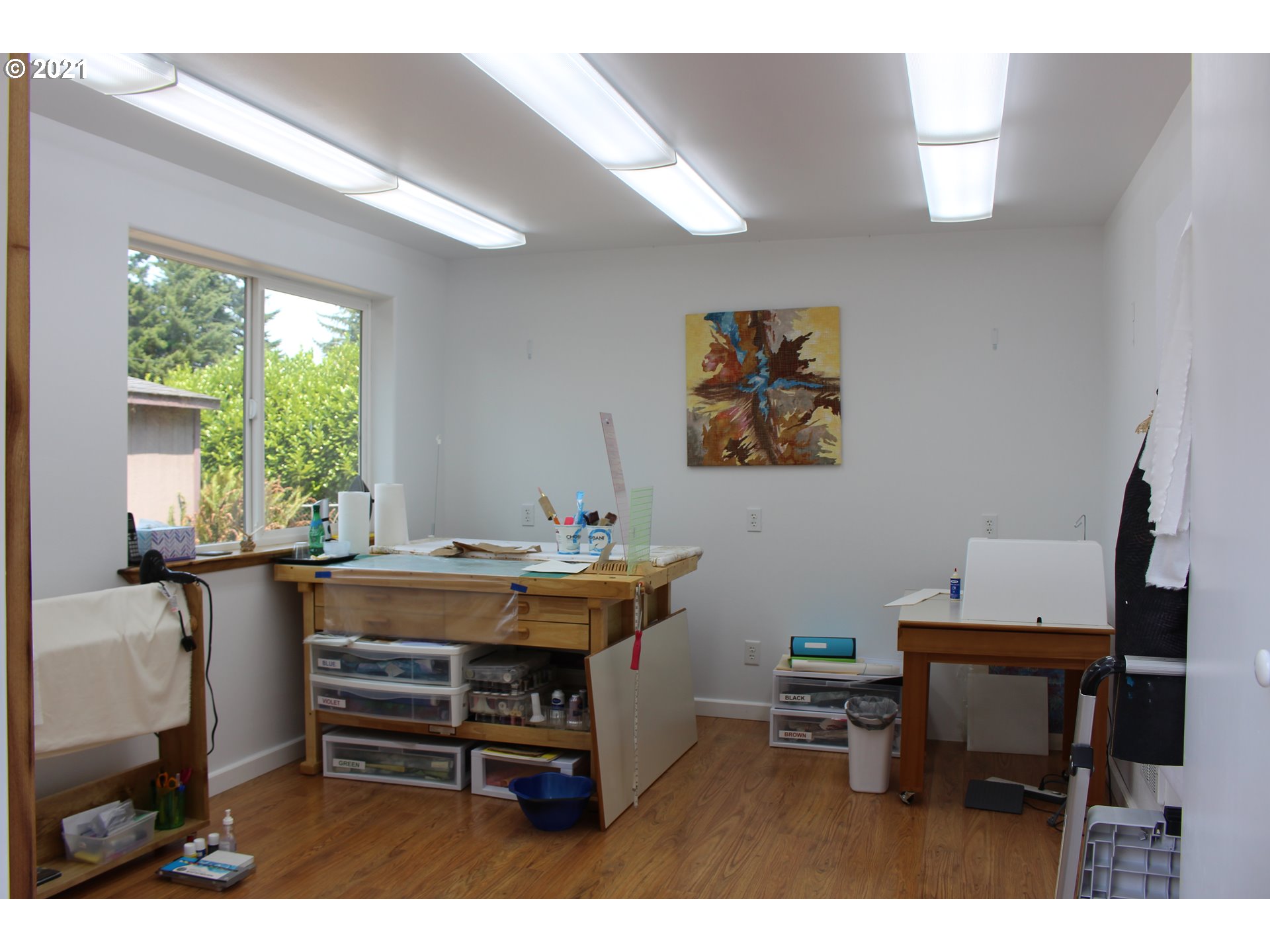 66069 North Bay Road North Bend, OR 97459 - Photo 29 of 32 a view of a workspace with furniture and a window