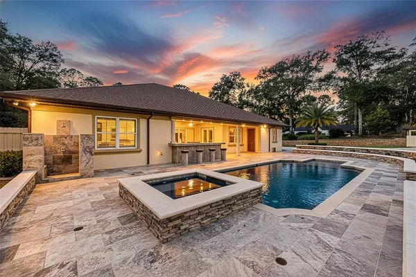 a view of a swimming pool with a patio