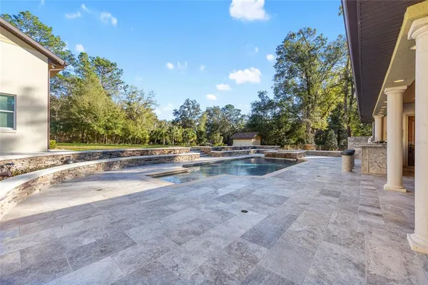 a view of a house with outdoor space and sitting area