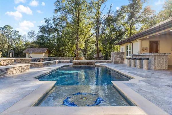 a view of a swimming pool with a patio