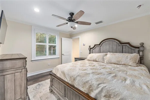 a aerial view of a house with a yard and large trees