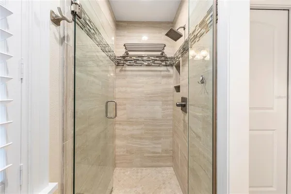 a view of a house with pool and sitting area