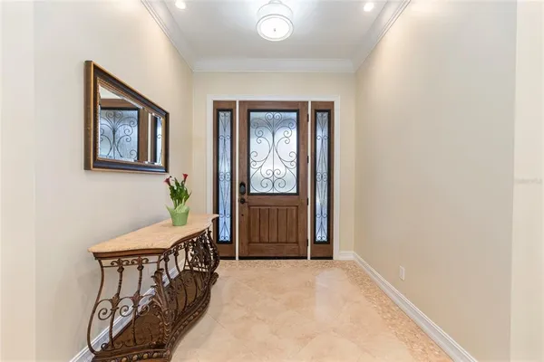 a large kitchen with a large counter top and stainless steel appliances