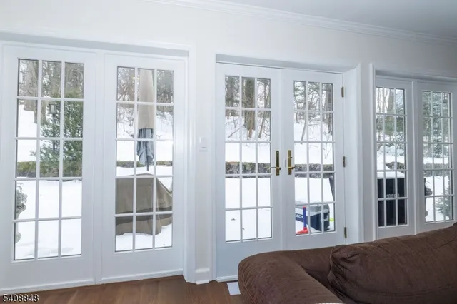 a living room with furniture and windows