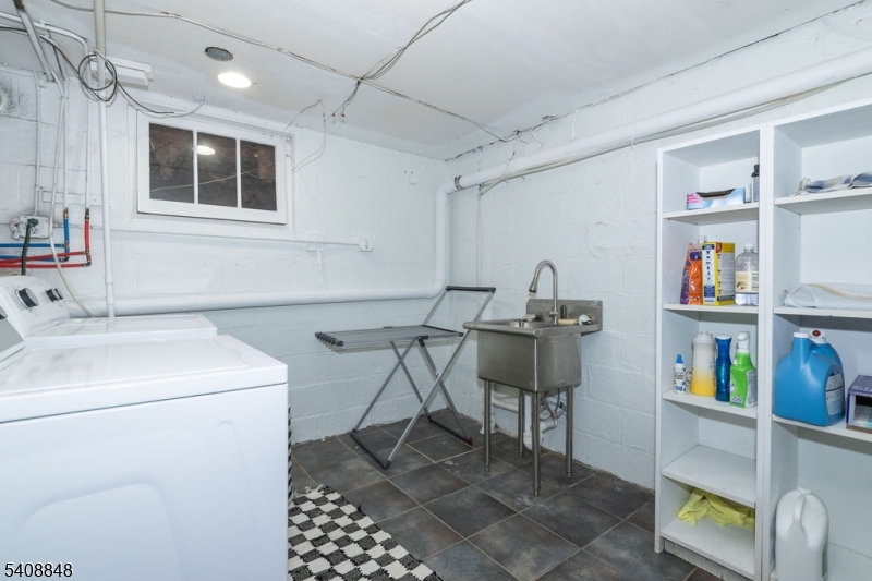 717 Fairmount Avenue Chatham, NJ 07928 - Photo 32 of 35 a storage room with washer and dryer