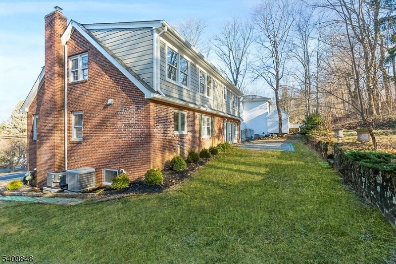 717 Fairmount Avenue Chatham, NJ 07928 - Photo 4 of 35 a view of a house with a yard