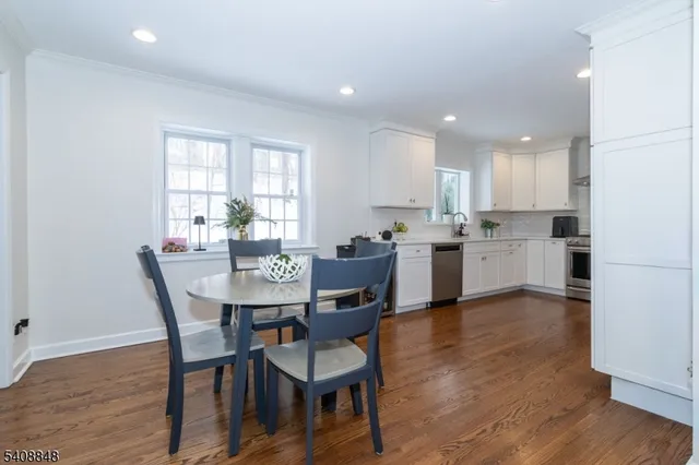 a view of kitchen with cabinets and wooden floor