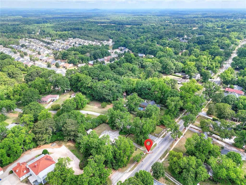 317 North Cherokee Road Social Circle, GA 30025 - Photo 32 of 32 an aerial view of residential house with outdoor space and trees around