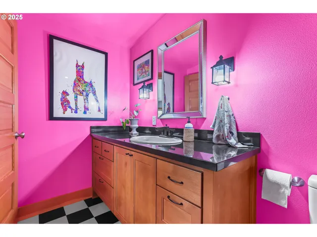 a view of a living room with bathroom